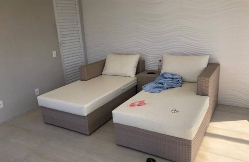 Leblon Apartment | Cozy bedroom and living room with balcony in Leblon.