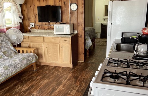 West Branch Cabin | Cozy Cabin at Water’s Edge: Sandy Beach, Kayaks, and Fun for the Whole Family