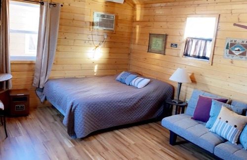 Napoleon Cabin | Cozy cabin. Sleeps 2-4. Includes kitchenette, Wi-Fi and an outdoor space.