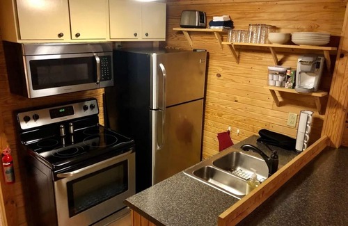 La Grange Cabin | Cozy Cabin w/firepit, tucked in the woods on a Kentucky farm. Nature awaits!