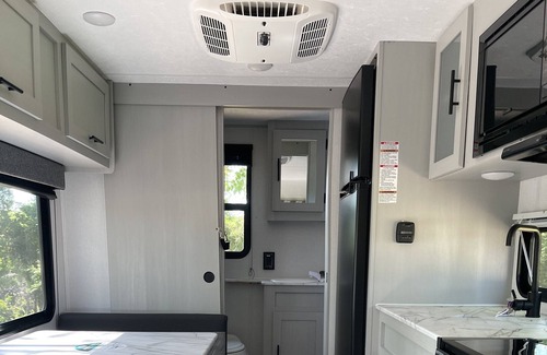 Abercrombie House | Cozy camper with full hookups, free parking, and free Wifi!