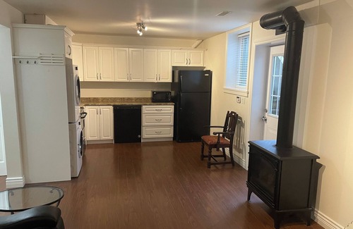 East Clayton House | Cozy, clean basement suite in beautiful Clayton Heights with gas fireplace!