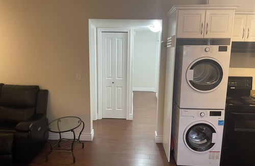 East Clayton House | Cozy, clean basement suite in beautiful Clayton Heights with gas fireplace!