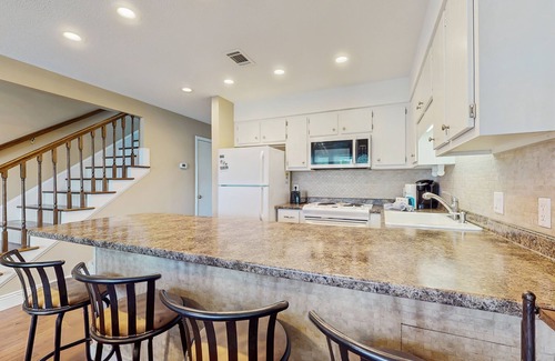 El Centro Beach Condo | Cozy coastal condo with a loft, shared pool and beach access