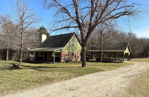 Rosston Cottage | Cozy cottage nestled next to Hart's Creek, surrounded by trees and wildlife.