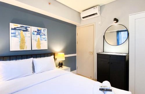 Cikarang Apartment | Cozy Designed 2BR with Working Room at Meikarta Apartment By Travelio