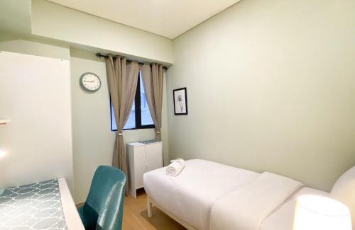 Cikarang Apartment | Cozy Designed 2BR with Working Room at Meikarta Apartment By Travelio