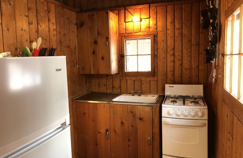 Pentwater Cabin | Cozy "Flip Flops" Cabin in the woods with Pentwater Lake frontage and access