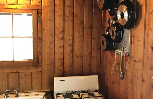 Pentwater Cabin | Cozy "Flip Flops" Cabin in the woods with Pentwater Lake frontage and access