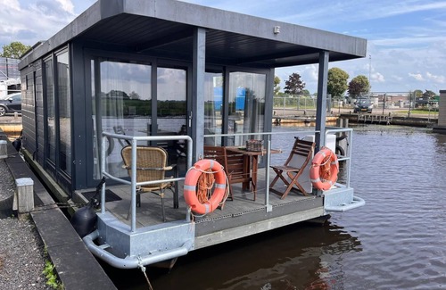 Steenwijk Boat Rental | Cozy Houseboat in Steenwijk near Giethoorn