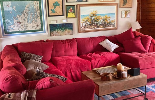 Gould City Cottage | Cozy log cabin on South Manistique Lake with 100 feet of sandy beach, sunsets