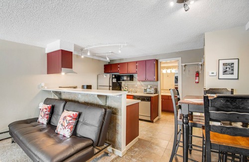 Wildernest Apartment | Cozy mountain view condo with patio - on bus route & great for skiing & boating
