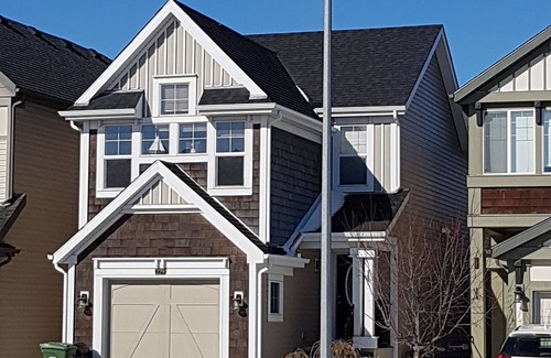 Southeast Calgary House | Cozy new unit near restaurants, bars, stores, bus stations, and hospital.
