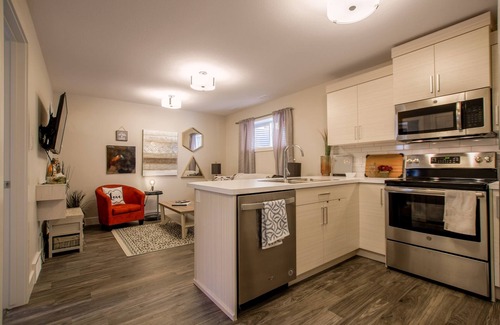Lethbridge House | Cozy one bedroom suite with a pullout in the living room.