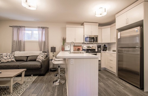 Lethbridge House | Cozy one bedroom suite with a pullout in the living room.