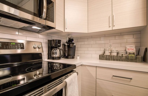 Lethbridge House | Cozy one bedroom suite with a pullout in the living room.