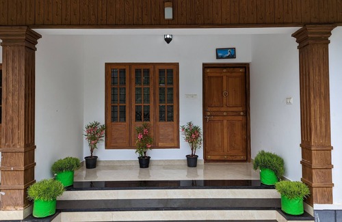 Irinjalakuda Villa | Cozy One Bedroom Villa Facing Paddy fields amidst a Fruit garden