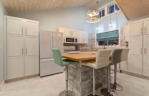 Mora House | Cozy one level - open floor plan, split bedrooms, in-floor heat, wood stove