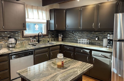East Stroudsburg Ski Chalet | Cozy Poconos retreat directly on Bushkill Creek w/firepit & wood pellet stove!