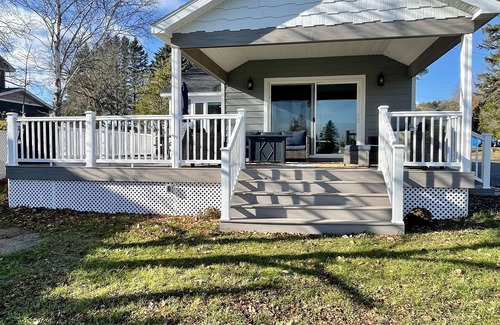 Oscoda Cottage | Cozy riverfront cottage with an easy beach-inspired coastal MI vibe!
