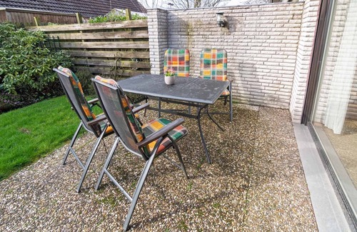 Harlesiel House | Cozy semi-detached house with fireplace and beautiful garden to relax.
