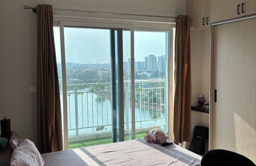 Agara Apartment | Cozy studio in pleasant Haralur with WiFi, AC and lake View