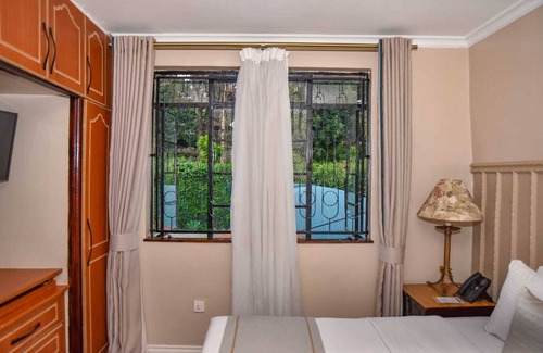 Muthaiga Hotel | Cozy Superior Room with AC & Fitness Access in Vibrant Nairobi