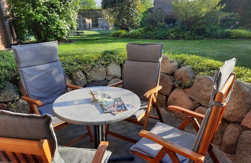 Ostseebad Kuhlungsborn Apartment | Cozy vacation apartment with natural stone terrace surrounded by greenery