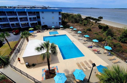 Tybee Island Condo | Cozy waterfront escape w. community pool + ocean views.