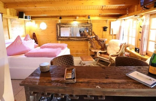 Neufeld House | Cozy wooden cottage quietly situated behind the dike with terrace