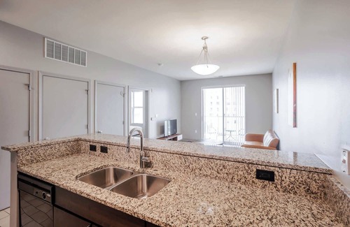 Central Business District Apartment | CozySuites at the Banks gym, pool 07