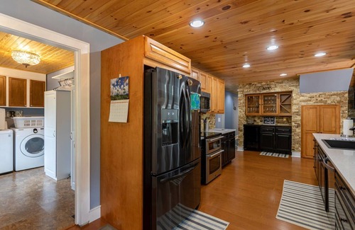 Newland House | Creekside Cabin in Linville with seasonal views of lake, golf access and large deck with hot tub!