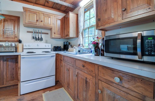 Raphine Cabin | Creekside historic log cabin w/modern amenities at historic Wade's Mill