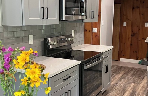 Woxall House | Creekside Retreat-spacious cottage nestled in the wildflowers and lush woods