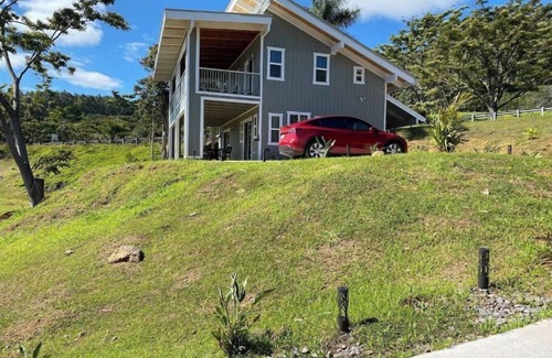 Honokaa Cottage | Custom cottage feels bright & airy yet cozy and private in this country setting.