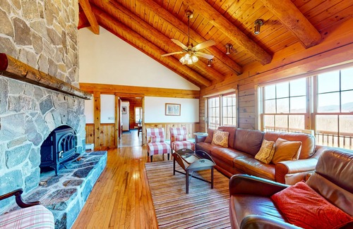 Easton House | Custom log home with wood stove, games, generous deck, & stunning mountain views