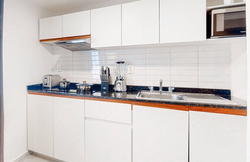 Downtown Cancun Hotel | Dazzling, centrally located apartment with luxe finishes and a shared pool