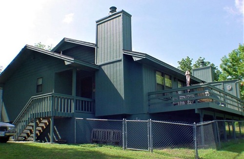 Holiday Island Condo | DECK OVERLOOKS THE PEACEFUL SERENITY OF THE LAKE