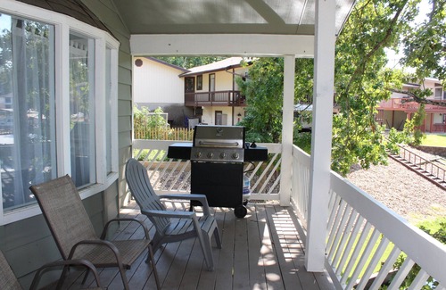 Osage Beach House | Deck & patio overlook the private boat dock, fire pit, & tons of land to explore