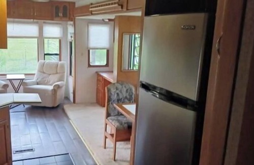 Madison House | Delightful 5th wheel w/queen bed, patio deck, and high speed internet.