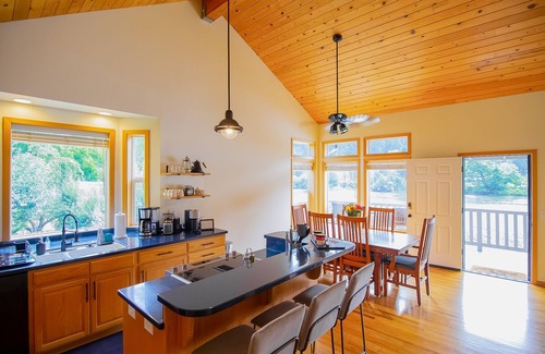 Mapleton House | Delightful riverfront home with dock, game room, fast WiFi, kayaks & grill