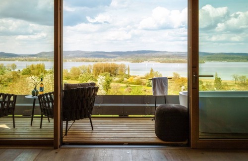 Gundholzen Apartment | Deluxe double room with partial lake view