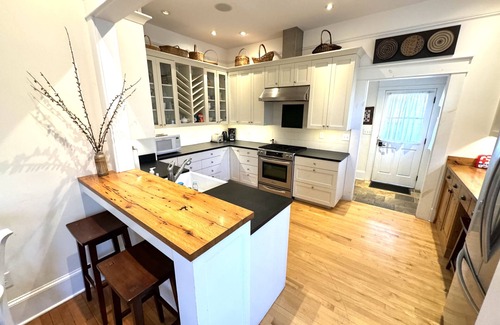 Brevard House | Deluxe Downtown Bungalow - fenced in yard, pet friendly.