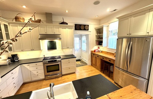 Brevard House | Deluxe Downtown Bungalow - fenced in yard, pet friendly.