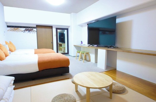 Miyazaki Hotel | Deluxe room with tatami space 2 semidouble beds/Miyazaki Miyazaki