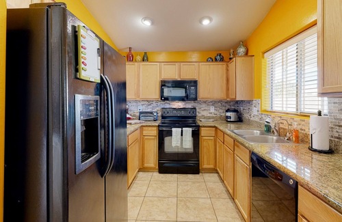 Power Ranch House | Desert oasis with an enclosed yard, firepit, washer/dryer, and central AC