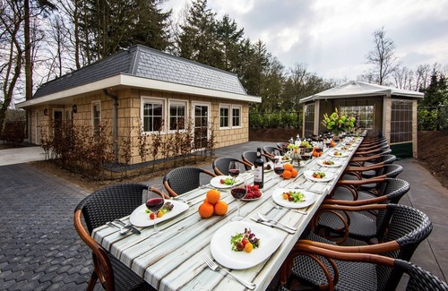 De Bult Villa | Designed home with bedstead, surrounded by forest