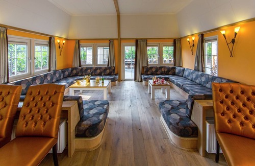 De Bult Villa | Designed home with bedstead, surrounded by forest