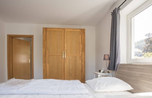 Elkeringhausen Apartment | Directly adjacent to hiking trails in a wooded area with mountains and a small lake