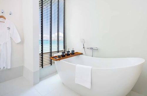 Farukolhufushi Island Hotel | Dive into Music: Overwater Villas & Underwater Tunes Await You!